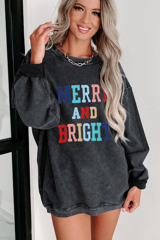 Sudadera con cordón bordada MERRY AND BRIGHT negra