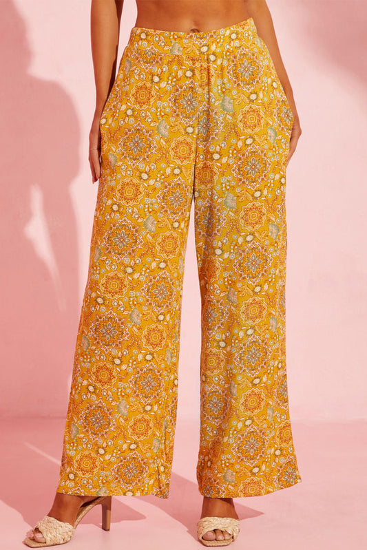 Pantalones anchos con bolsillos y estampado floral bohemio amarillo 