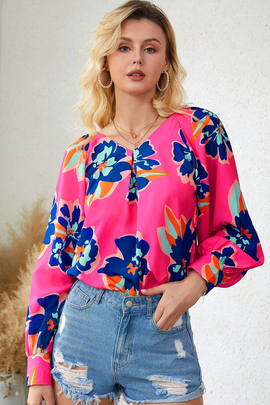 Blusa con mangas abullonadas y estampado de flores 