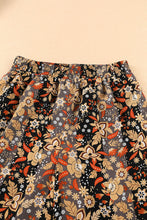 Pantalones anchos de cintura alta con estampado floral 