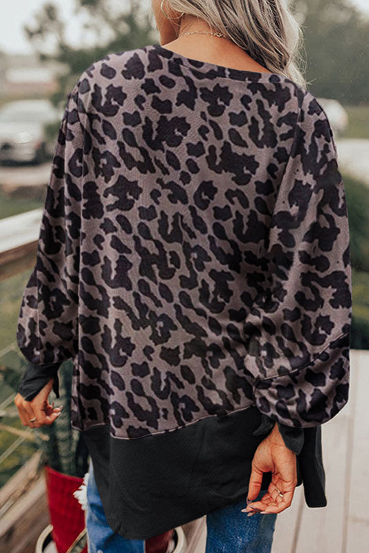 Sudadera con abertura y manga obispo con patchwork de leopardo negra