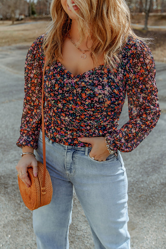 Blusa floral negra con cuello en V y manga de burbuja de talla grande 