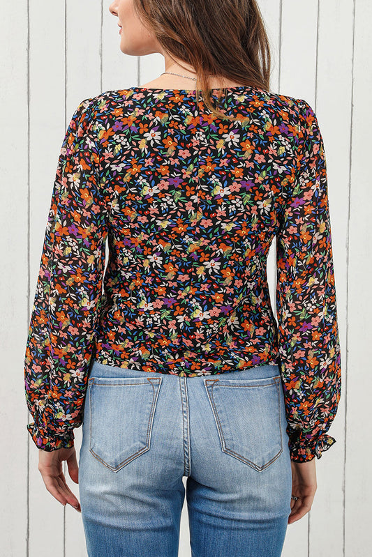 Blusa floral negra con cuello en V y manga de burbuja de talla grande 