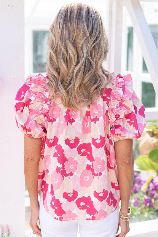 Top floral con mangas abullonadas y volantes con cuello dividido