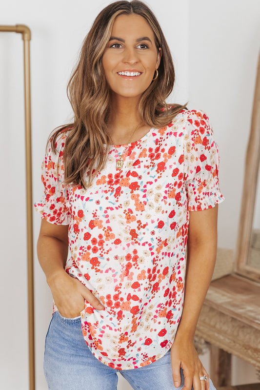 Blusa floral con mangas de burbuja y volantes 