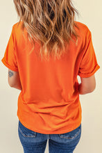 Camiseta con cuello redondo y estampado de cara de calabaza de Halloween naranja